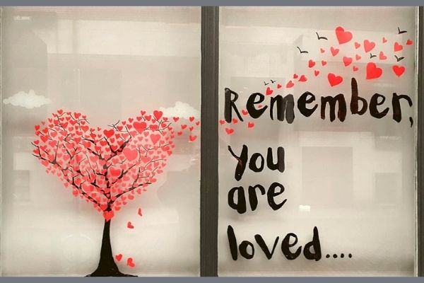 Image of a window display sharing positive messages for February