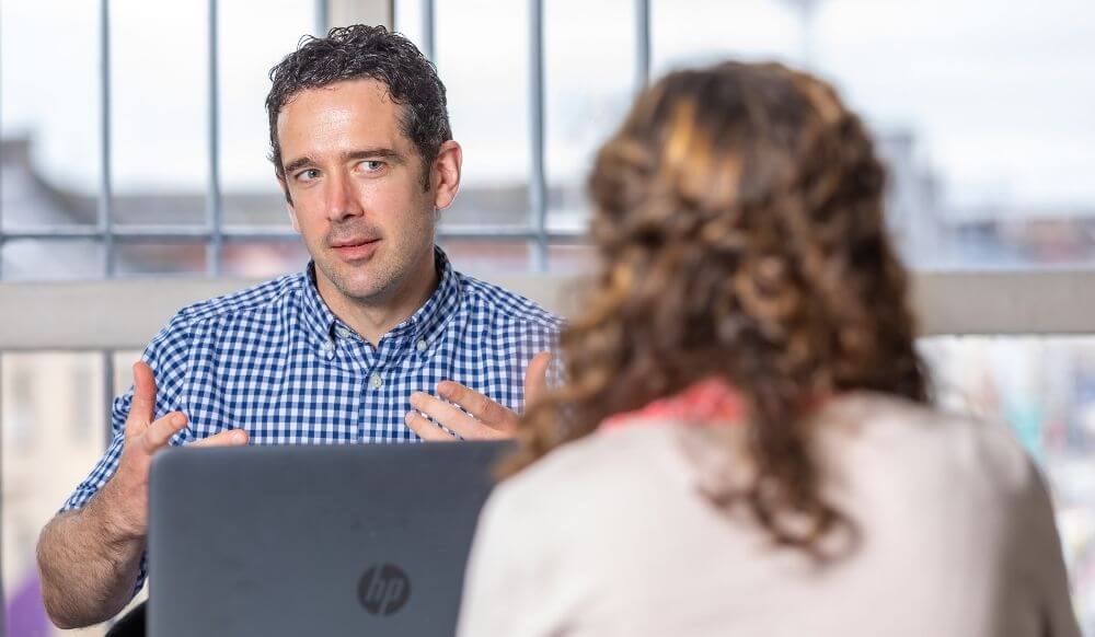 Specific types of needs Male clinician chats to client
