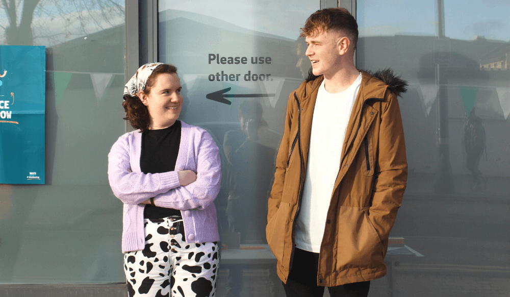 Good mental health A young woman and young man chatting outside