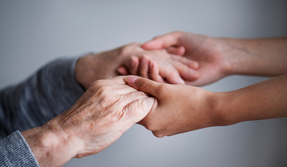 young pair of hands holding old pair of hands young pair of hands holding old pair of hands