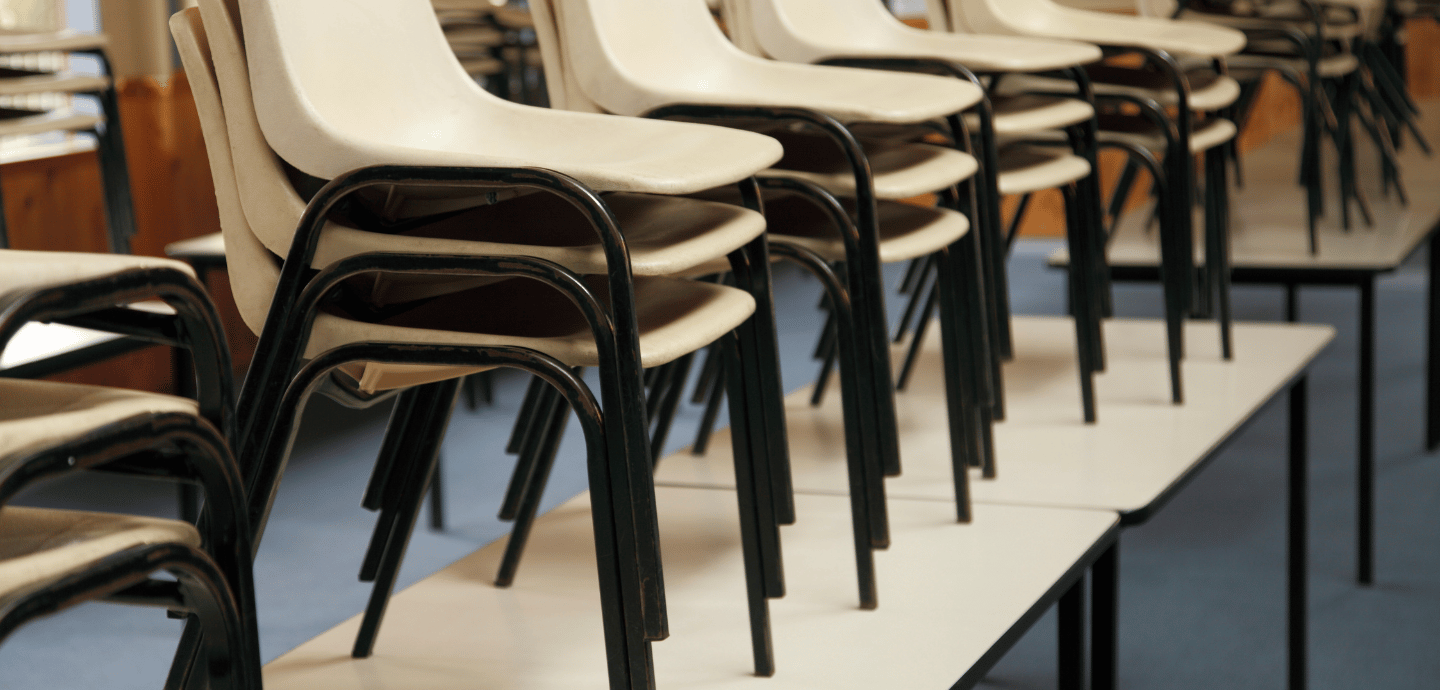 Schools chairs stacked on tables